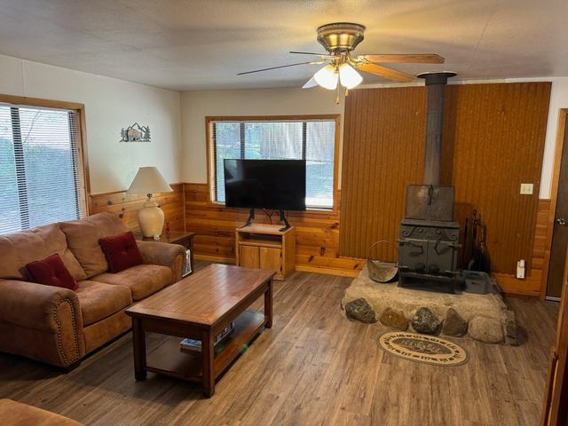 Black Bear cabin living room with a wood stove