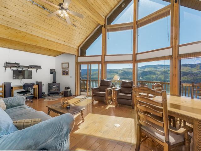 Lake Vista's living room with floor-to-ceiling windows over the valley