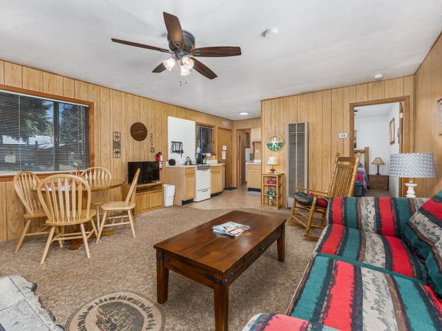 Teddy Bear cabin living room with a wood fireplace
