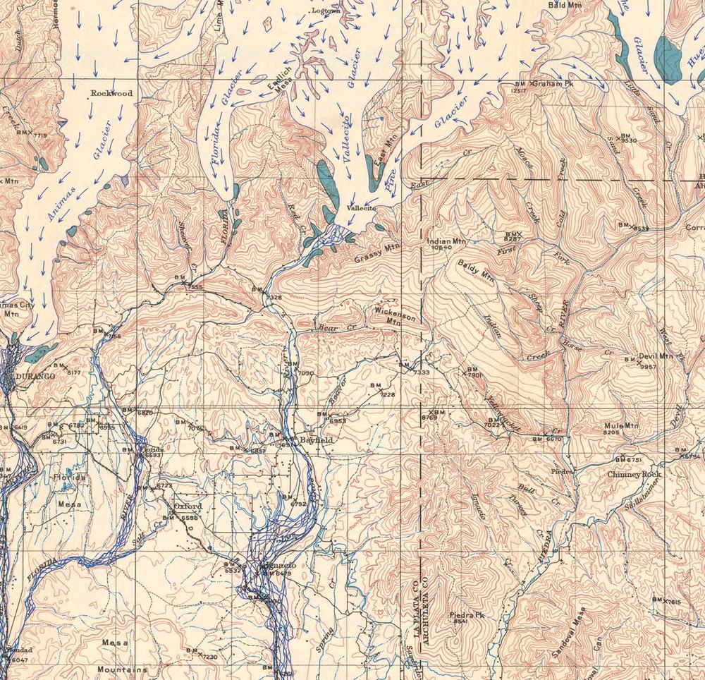Detail of a 1932 topographic map of the San Juan Mountains with Ice Age glaciers drawn back in. Pale ice tongues fill the upper Vallecito Creek and Pine River valleys and stop abruptly just above the settlement of Vallecito, with blue arrows showing ice flowing south. Bayfield, Ignacio and Durango sit on open, unglaciated ground well below the ice.
